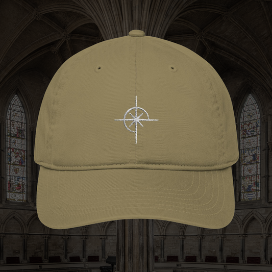 Grant Us Night Sigil tan baseball cap with white star symbol embroidered against a cathedral background