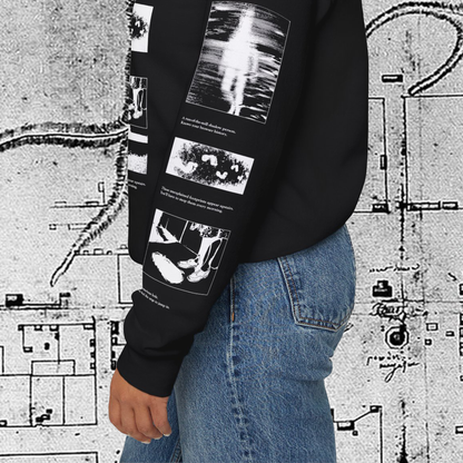 Grant Us Night Horror House black sweatshirt sleeve with white graphic design text and a haunted house with ghosts and footprints and cursed objects and illustrations on a textured background