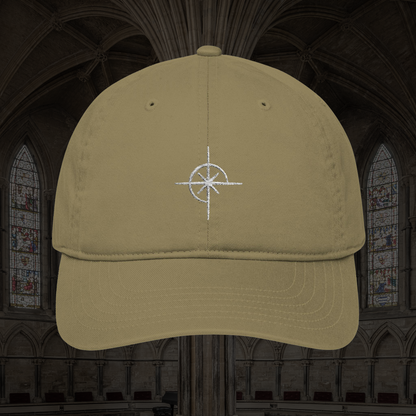 Grant Us Night Sigil tan baseball cap with white star symbol embroidered against a cathedral background